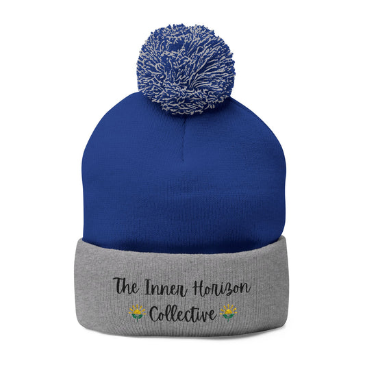 Front view of Pom-Pom Knit Cap in royal and heather grey — colorful winter beanie with pom-pom and logo