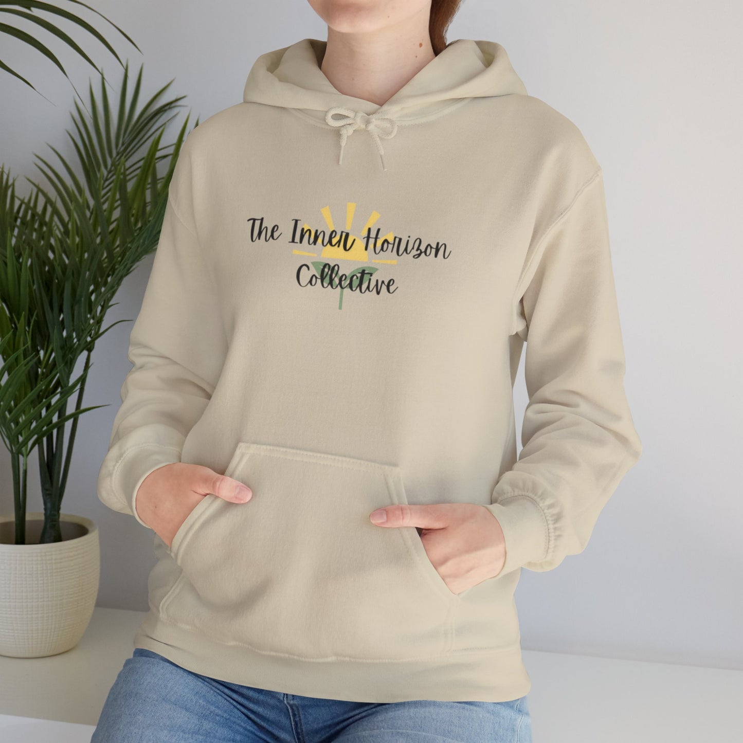 Front view of The Inner Horizon Collective hoodie in Sand with black logo — neutral-toned cozy pullover.