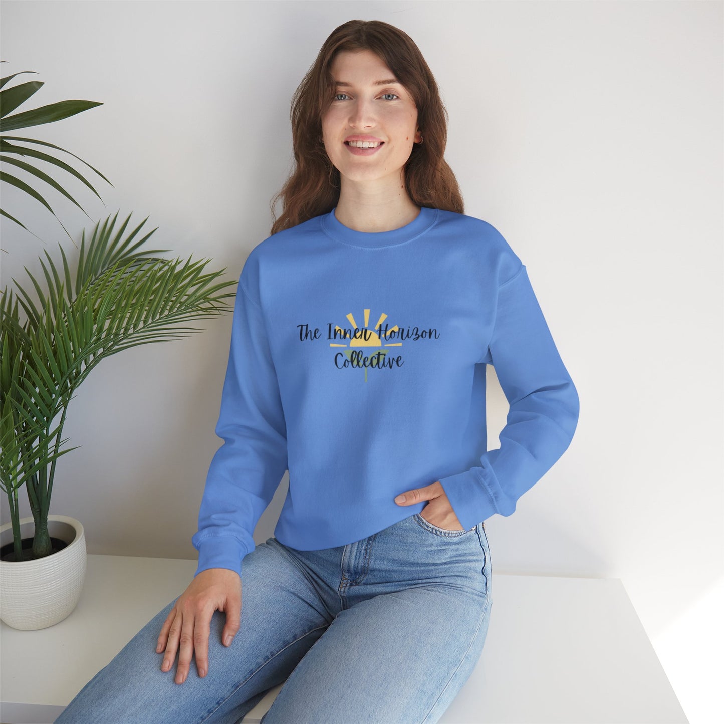 Front view of The Inner Horizon Collective unisex sweatshirt in Carolina Blue with black logo — cozy pullover for casual wear.