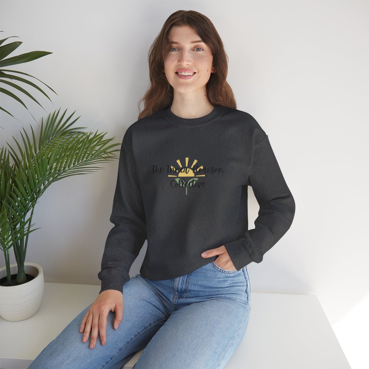 Front view of The Inner Horizon Collective unisex sweatshirt in Dark Heather with black logo — relaxed fit streetwear pullover.