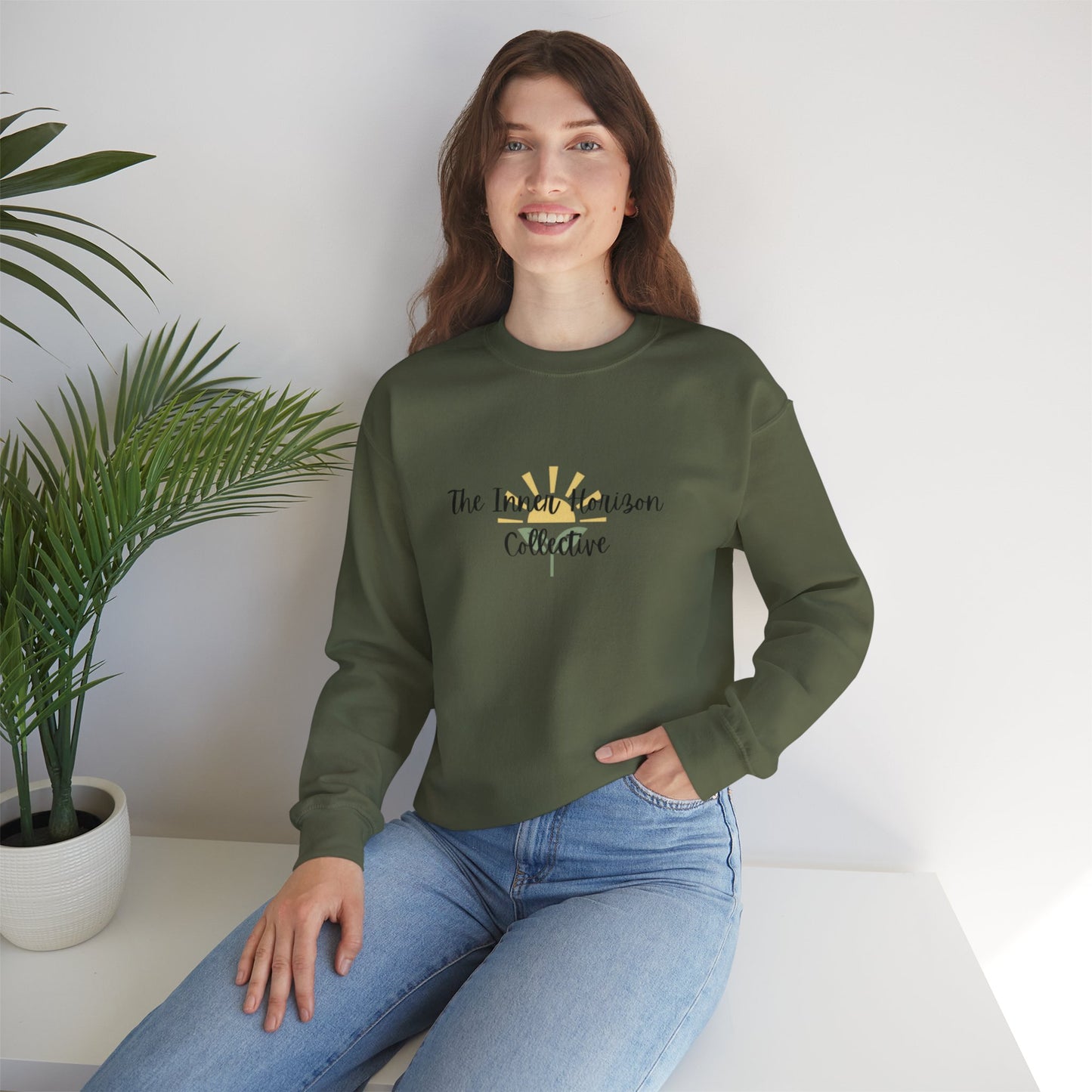 Front view of The Inner Horizon Collective unisex sweatshirt in Military Green with black logo — earthy-toned casual wear.