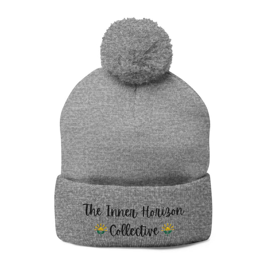 Front view of Pom-Pom Knit Cap in heather grey — cozy cold-weather winter hat with pom-pom and embroidered logo