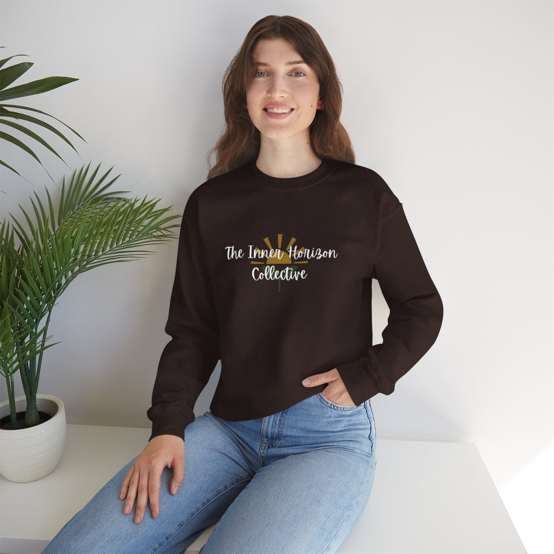 Front view of The Inner Horizon Collective unisex sweatshirt in Dark Chocolate with white logo — cozy pullover for self-care and casual wear.