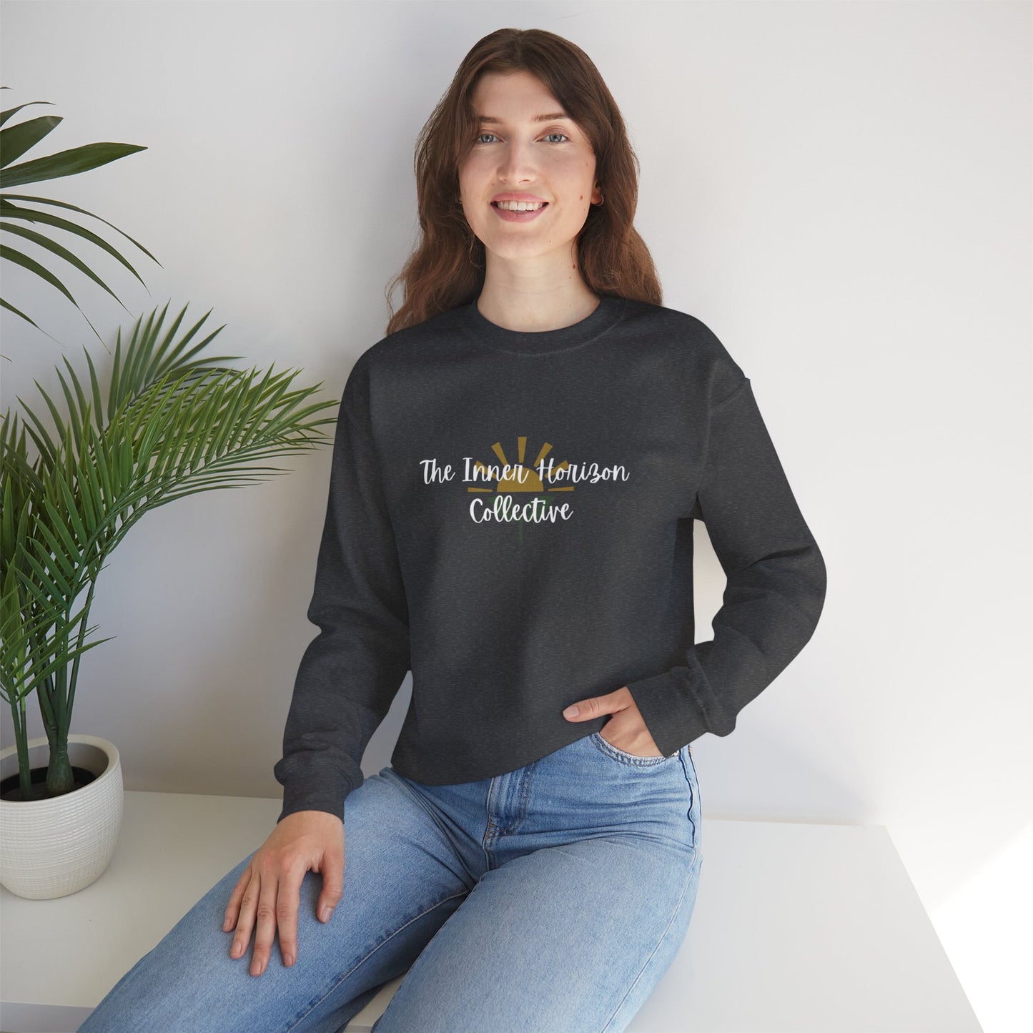 Front view of The Inner Horizon Collective unisex sweatshirt in Dark Heather with white logo — relaxed fit streetwear pullover.